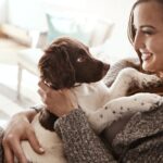 Smile,,Happy,And,Woman,With,Dog,On,Sofa,Bonding,With